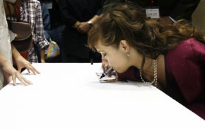 Lena signing autographs